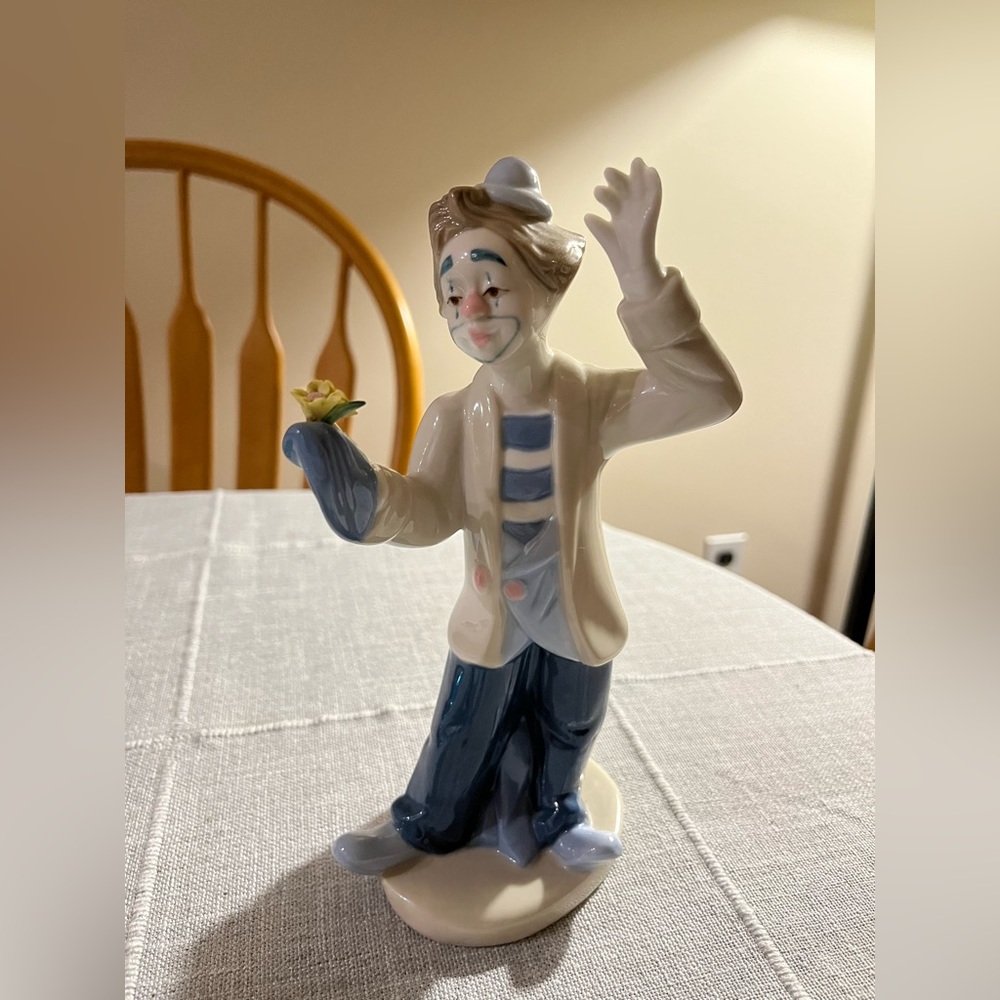 Vintage Paul sebastian Desako clown porcelain figurine with flowers.